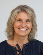 Et nærbilde av en person som smiler Et nærbilde av en person som smiler